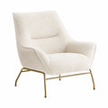 Sillón de tela bouclé crema con patas metálicas doradas